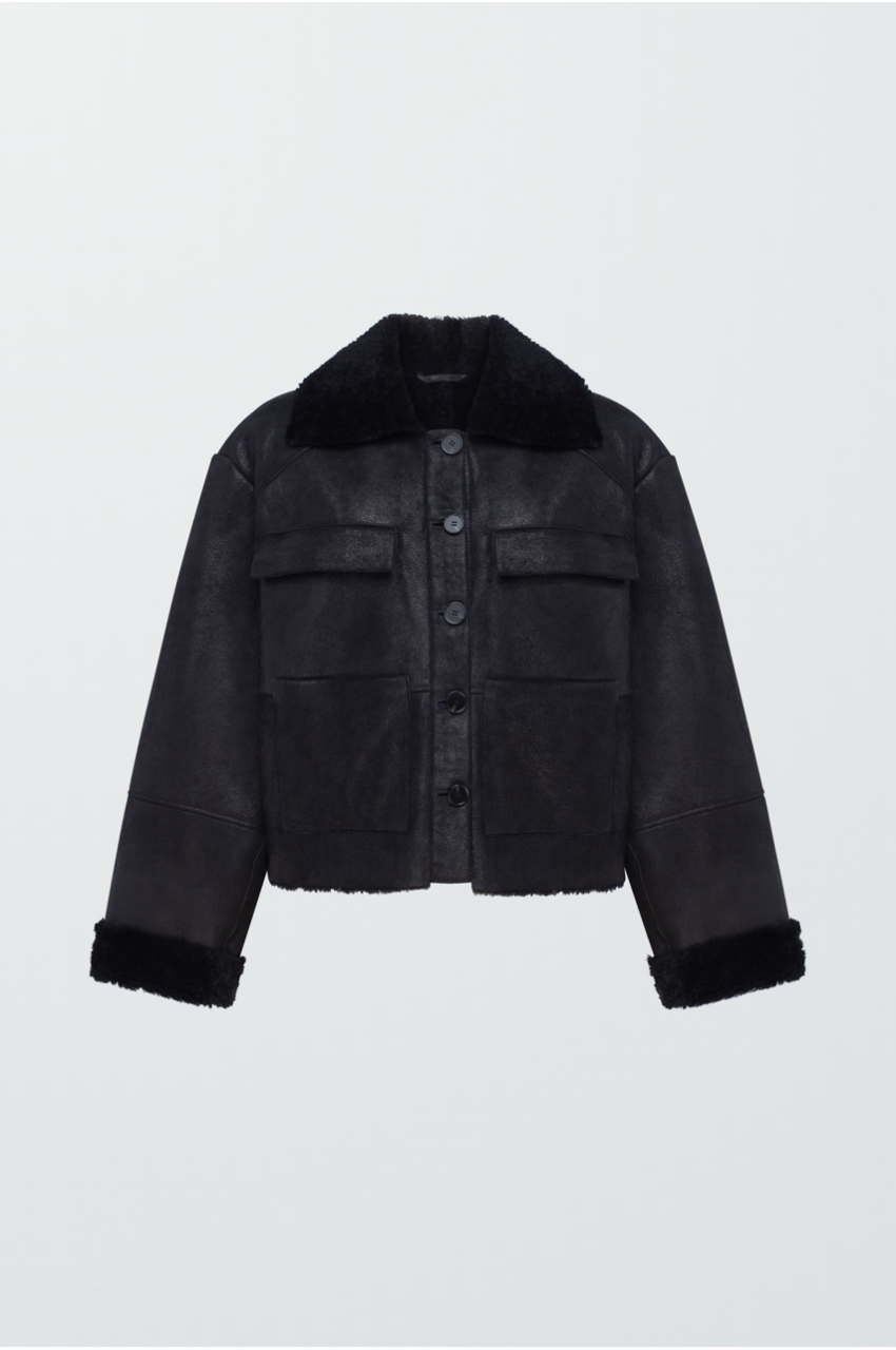 Коротка дублянка чорного кольору - фото 0